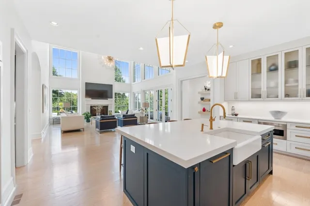 a bedroom with furniture and a painting on the wall