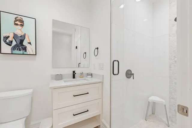 a living room with furniture a large window and a flat screen tv