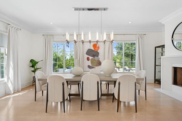 a dining room filled with furniture and window