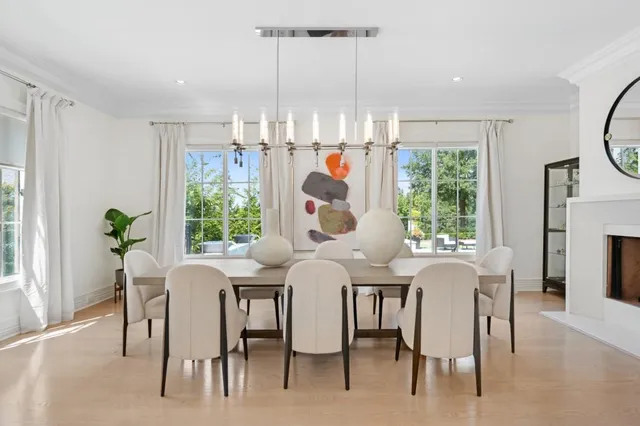 a dining room filled with furniture and window
