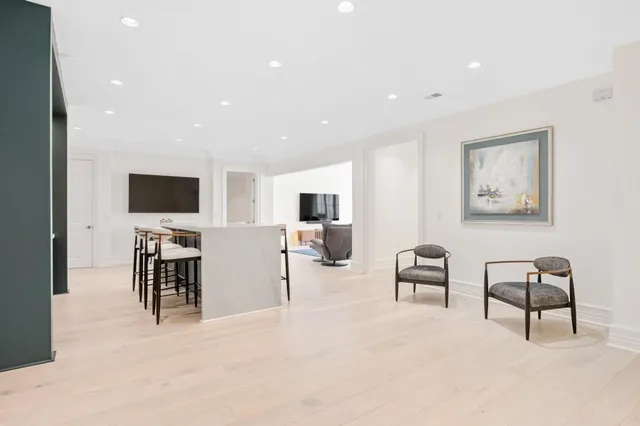 a view of a house with backyard sitting area and swimming pool