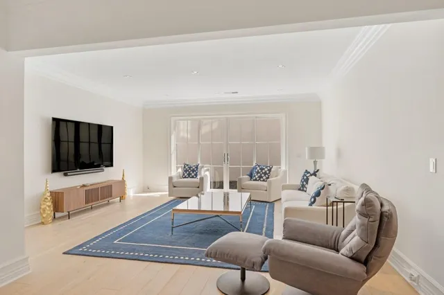 a view of a house with swimming pool and sitting area