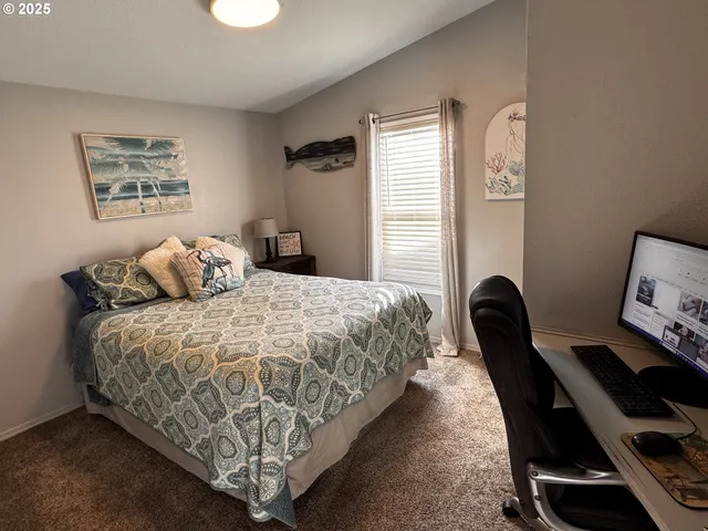 a bedroom with bed and window