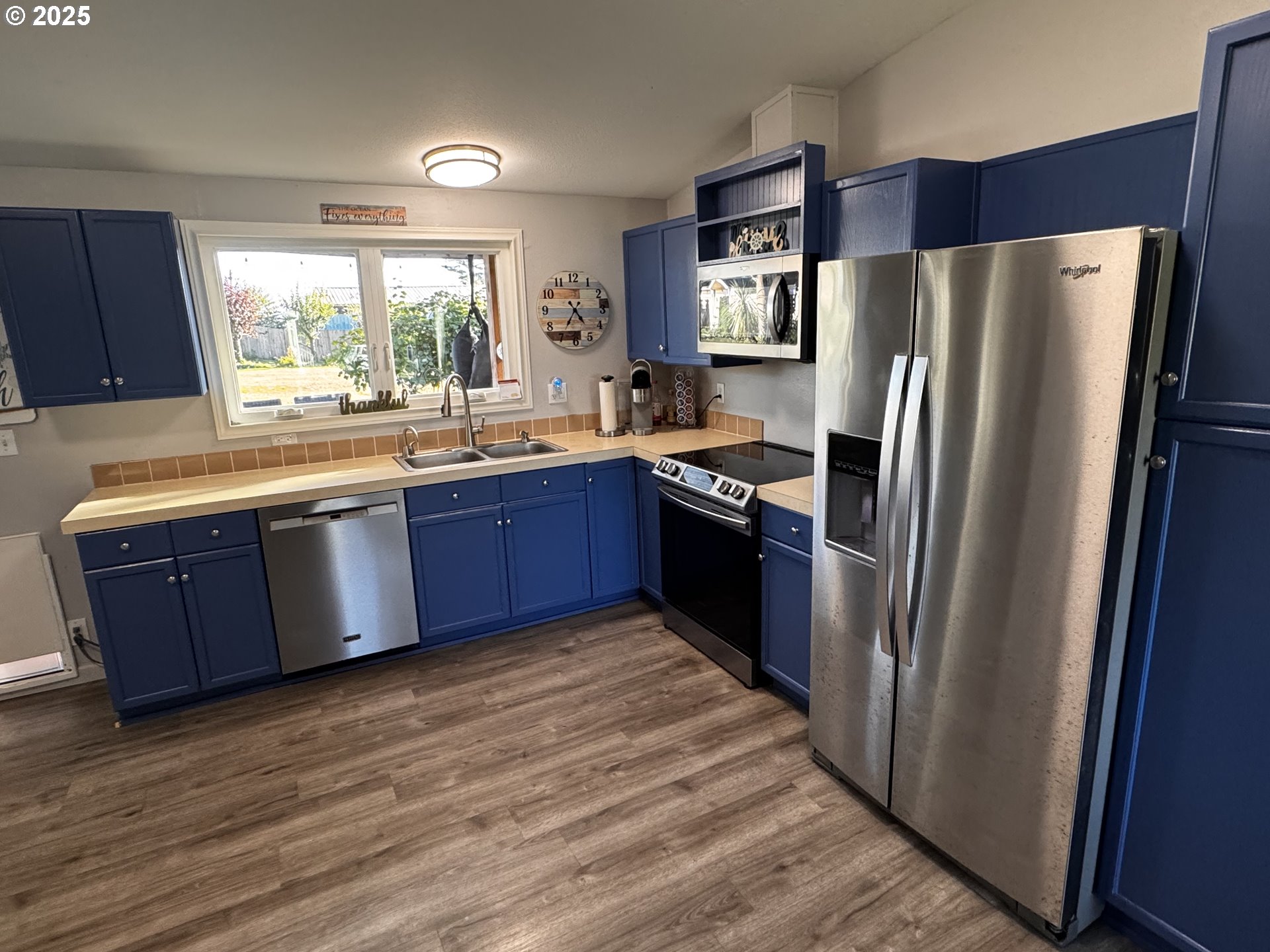 97818 Hanscam Lane Brookings, OR 97415 - Photo 13 of 44 a kitchen with stainless steel appliances granite countertop a refrigerator a sink a stove and a refrigerator