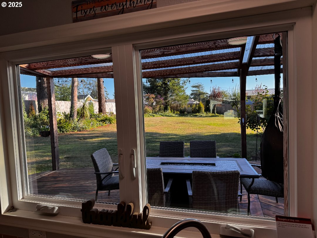 97818 Hanscam Lane Brookings, OR 97415 - Photo 14 of 44 a room with furniture and a window