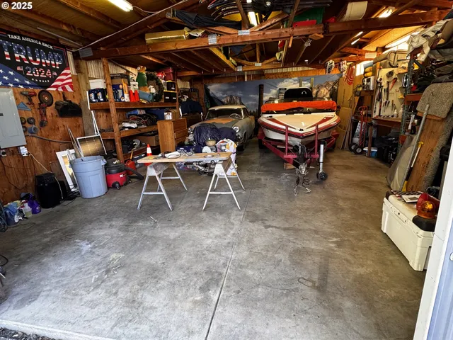 a view of a chairs and table in backyard
