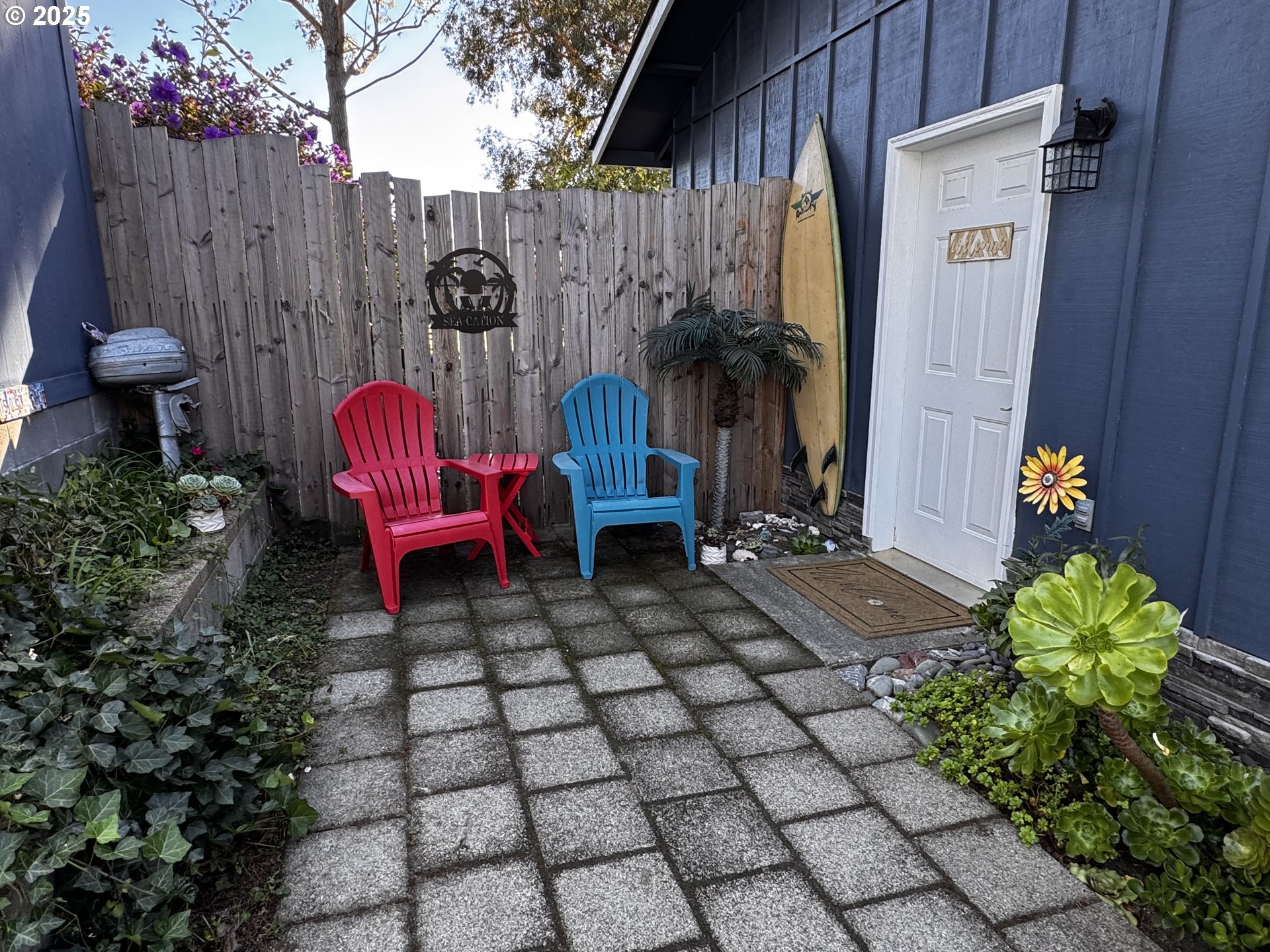 97818 Hanscam Lane Brookings, OR 97415 - Photo 35 of 44 a view of a chairs and table in backyard