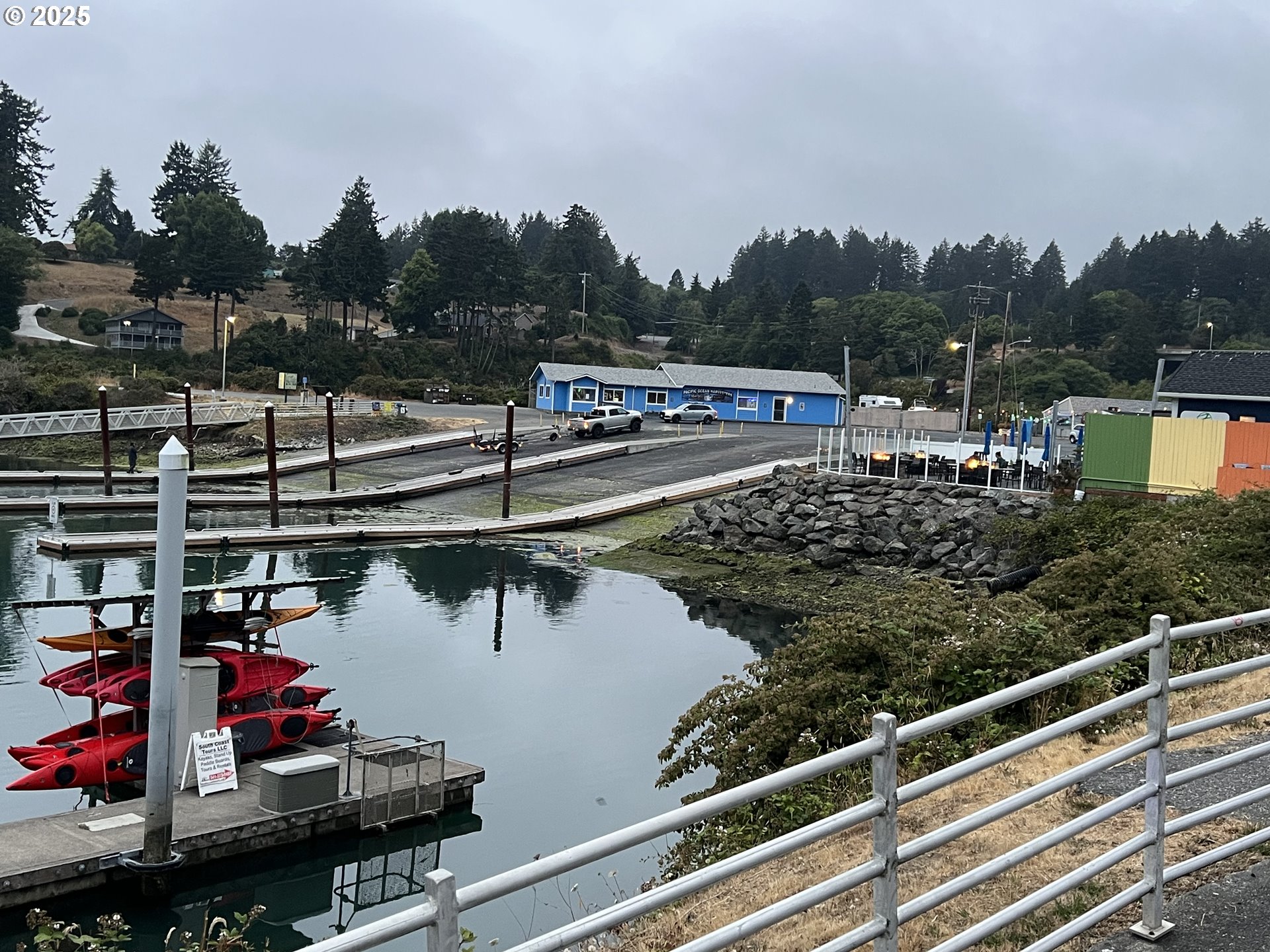97818 Hanscam Lane Brookings, OR 97415 - Photo 43 of 44 a view of a lake and outdoor seating