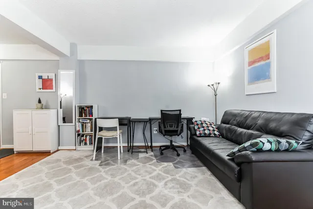 a living room with furniture and a table