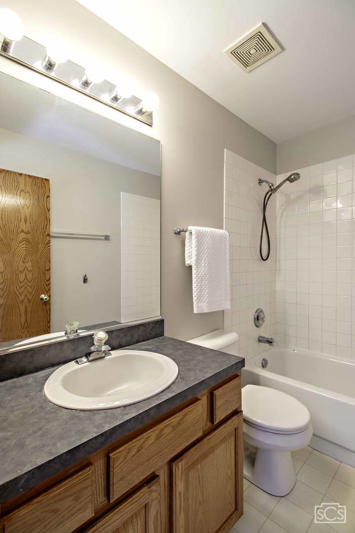 14 Peach Tree Court Algonquin, IL 60102 - Photo 15 of 20 a bathroom with a granite countertop sink toilet a mirror and shower