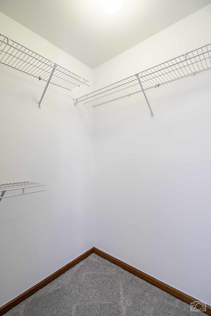 14 Peach Tree Court Algonquin, IL 60102 - Photo 17 of 20 a view of a room with racks on the wall