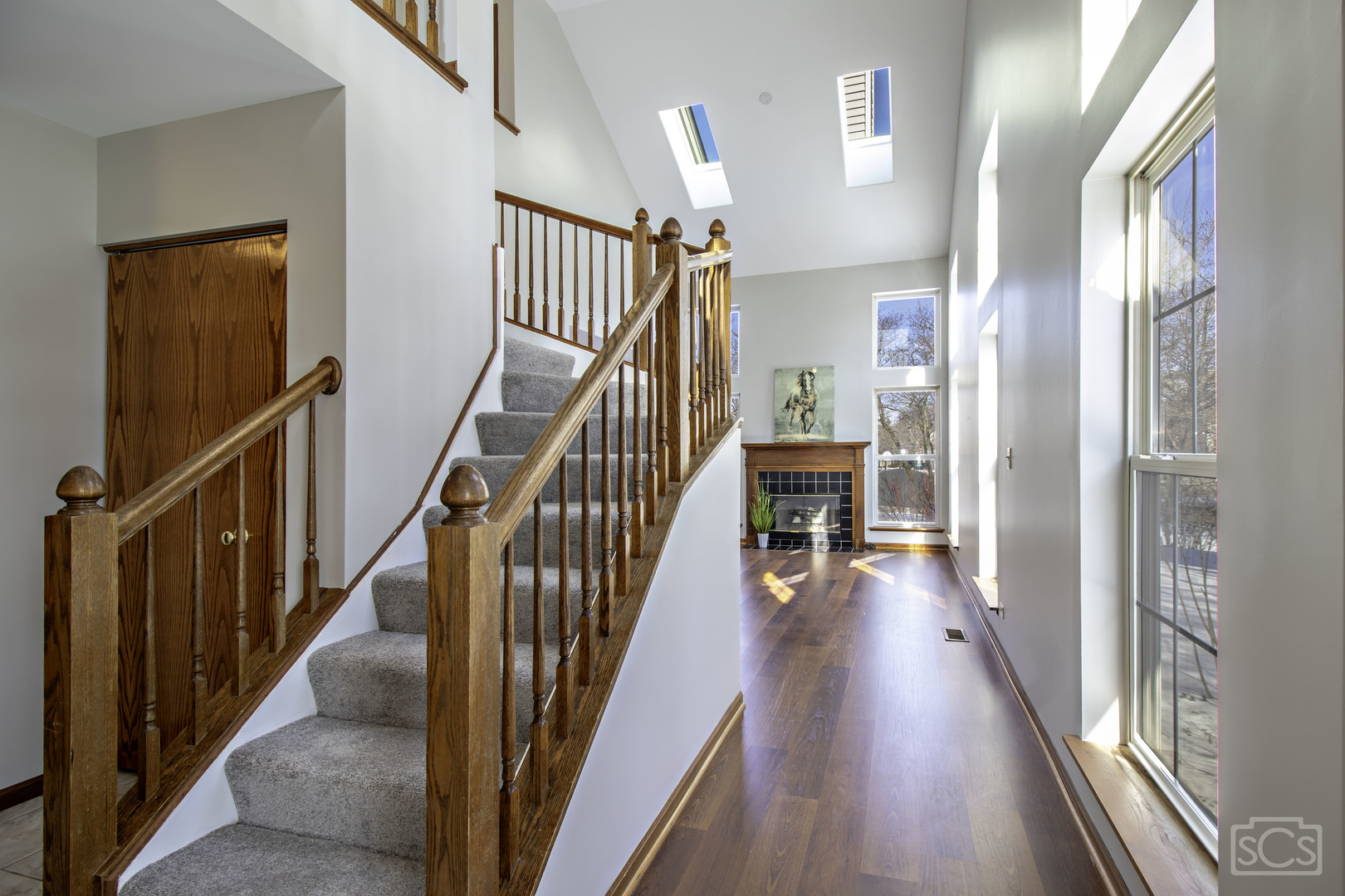 14 Peach Tree Court Algonquin, IL 60102 - Photo 4 of 20 a view of a hallway with wooden floor and stairs