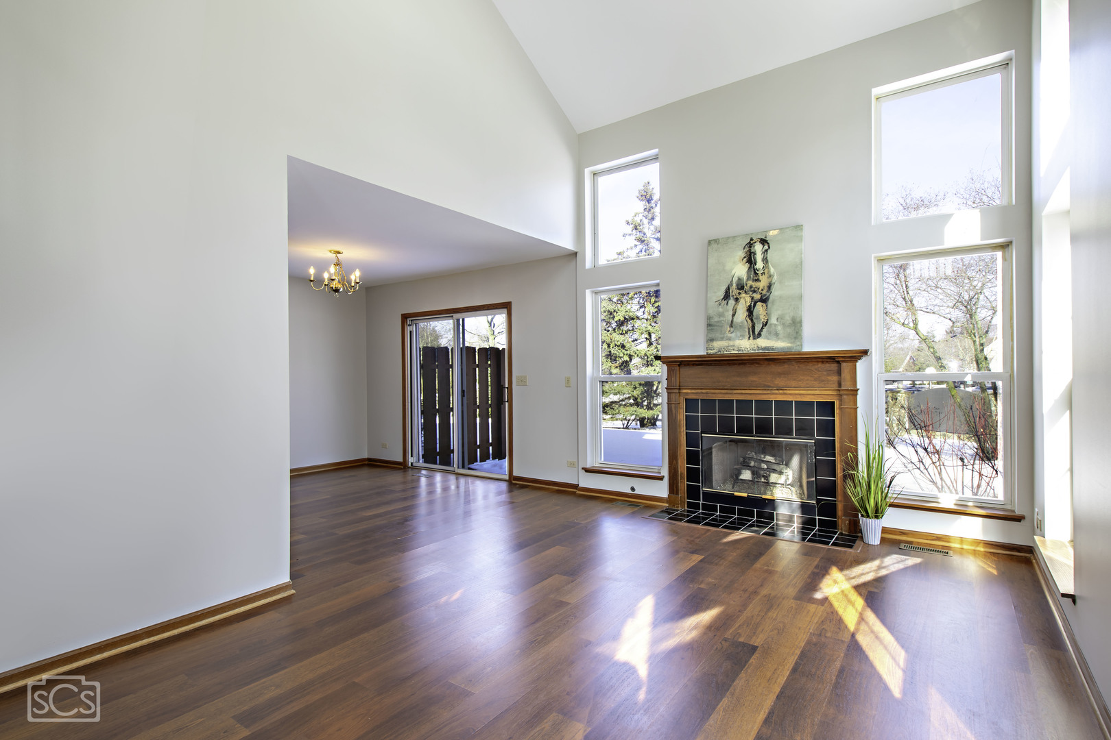 14 Peach Tree Court Algonquin, IL 60102 - Photo 5 of 20 an empty room with floor fireplace and windows