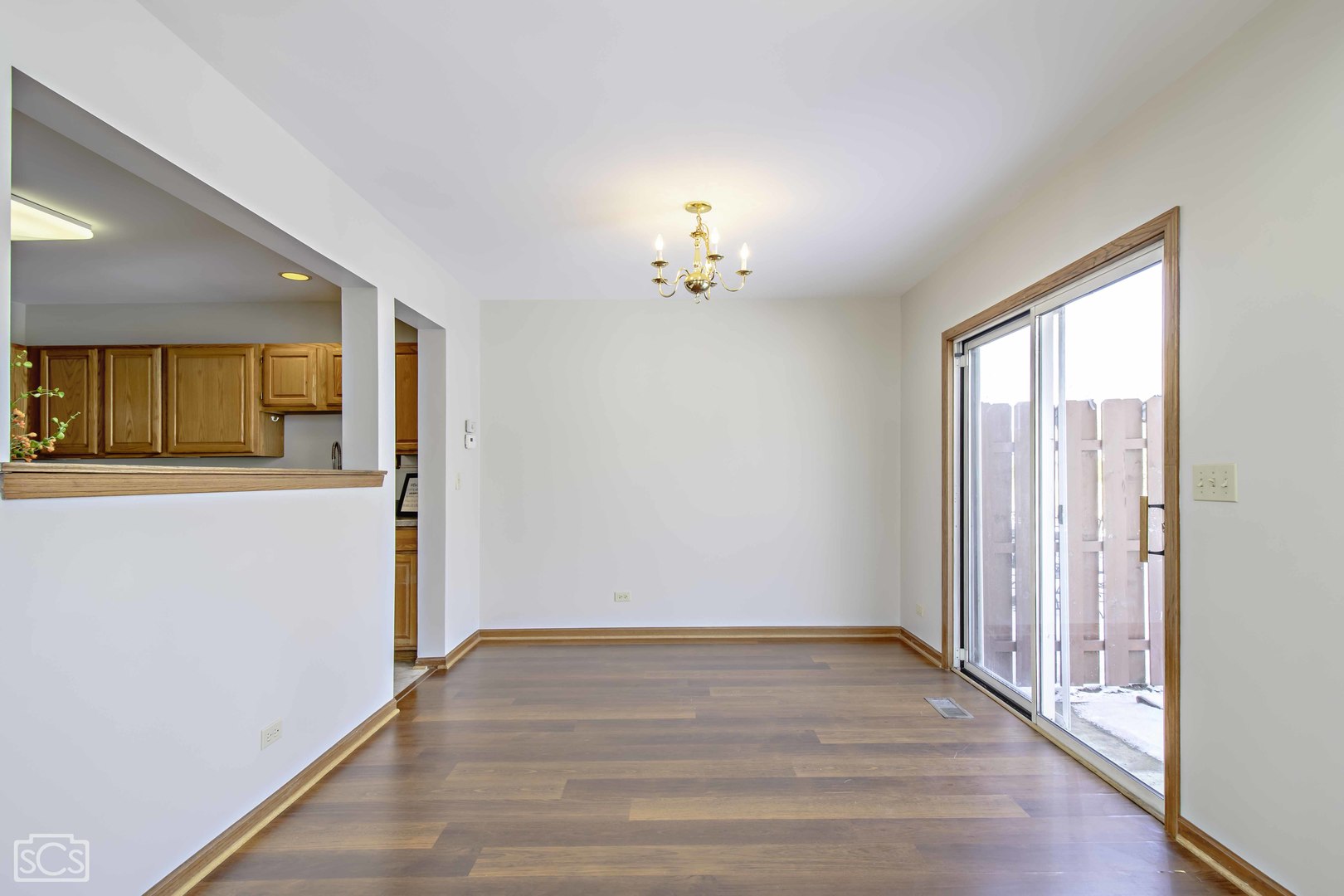 14 Peach Tree Court Algonquin, IL 60102 - Photo 7 of 20 a view of an empty room with wooden floor and a window