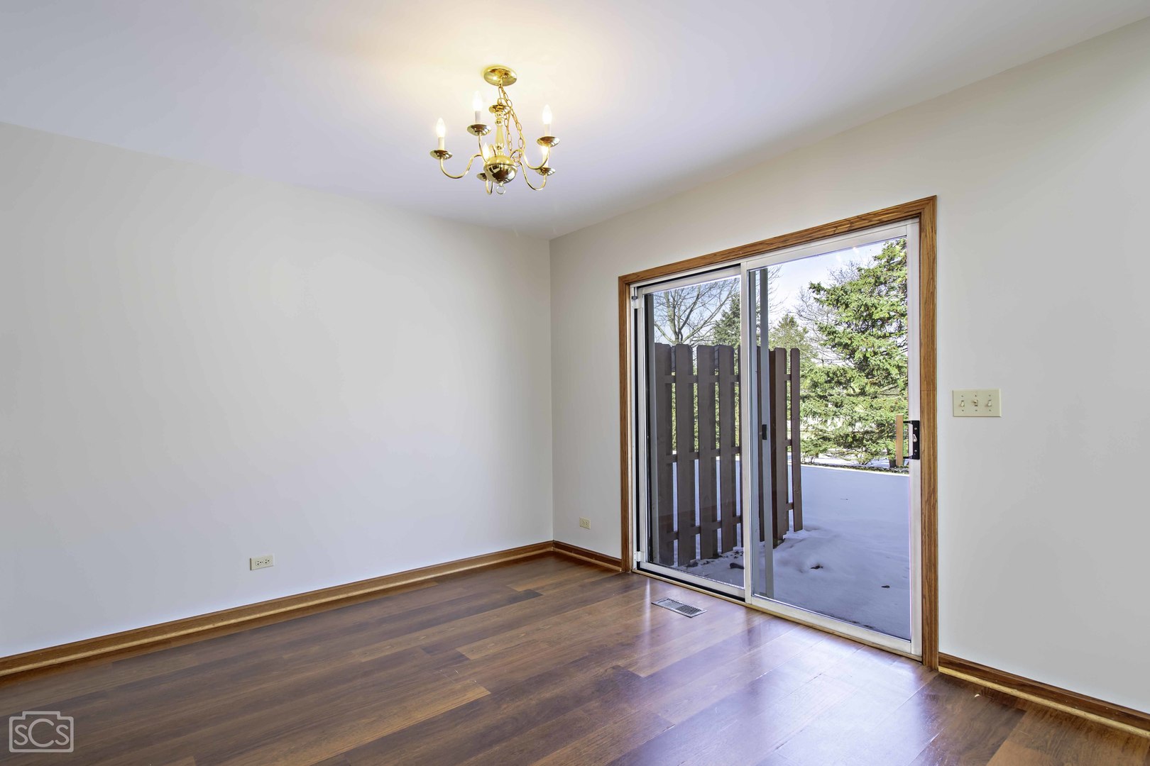 14 Peach Tree Court Algonquin, IL 60102 - Photo 8 of 20 a view of an empty room with wooden floor and a window