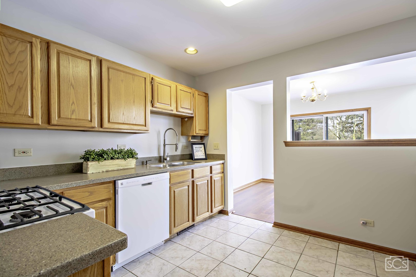 14 Peach Tree Court Algonquin, IL 60102 - Photo 10 of 20 a kitchen with stainless steel appliances granite countertop a stove a sink and a refrigerator