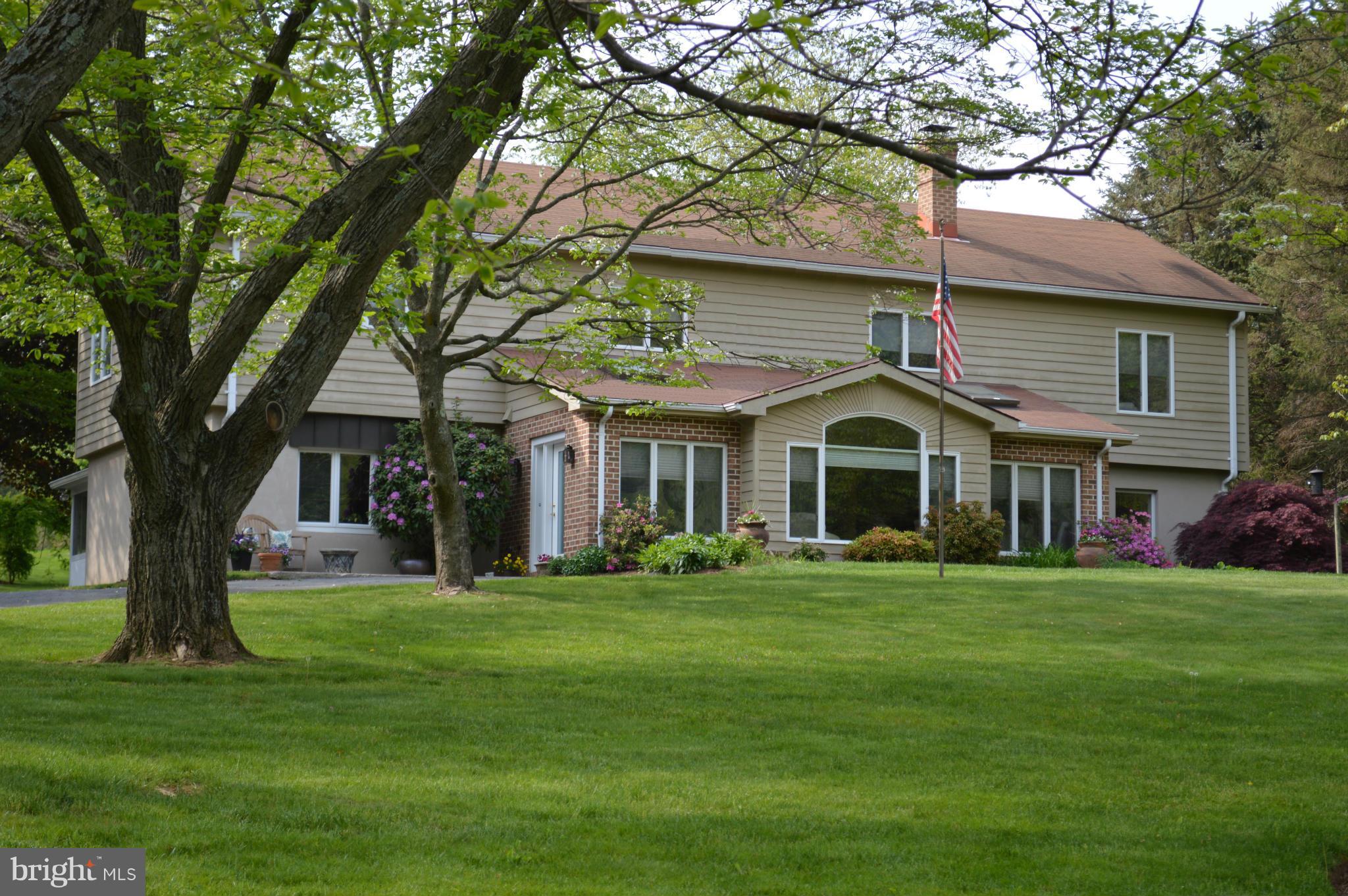 22524 Shiloh Church Road Boyds, MD 20841 - Photo 1 of 20 a front view of a house with a garden