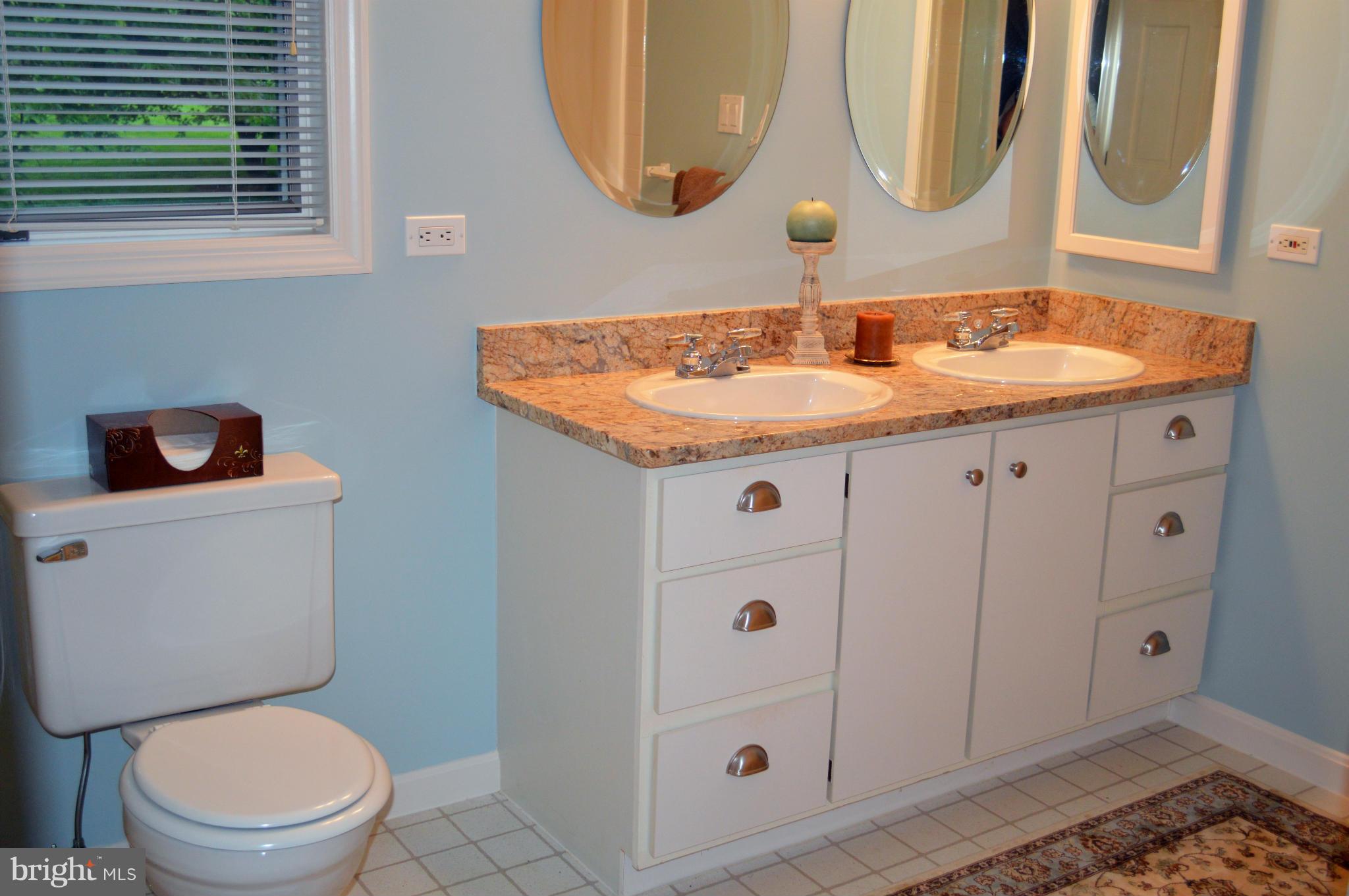 22524 Shiloh Church Road Boyds, MD 20841 - Photo 14 of 20 a bathroom with a granite countertop sink and a mirror