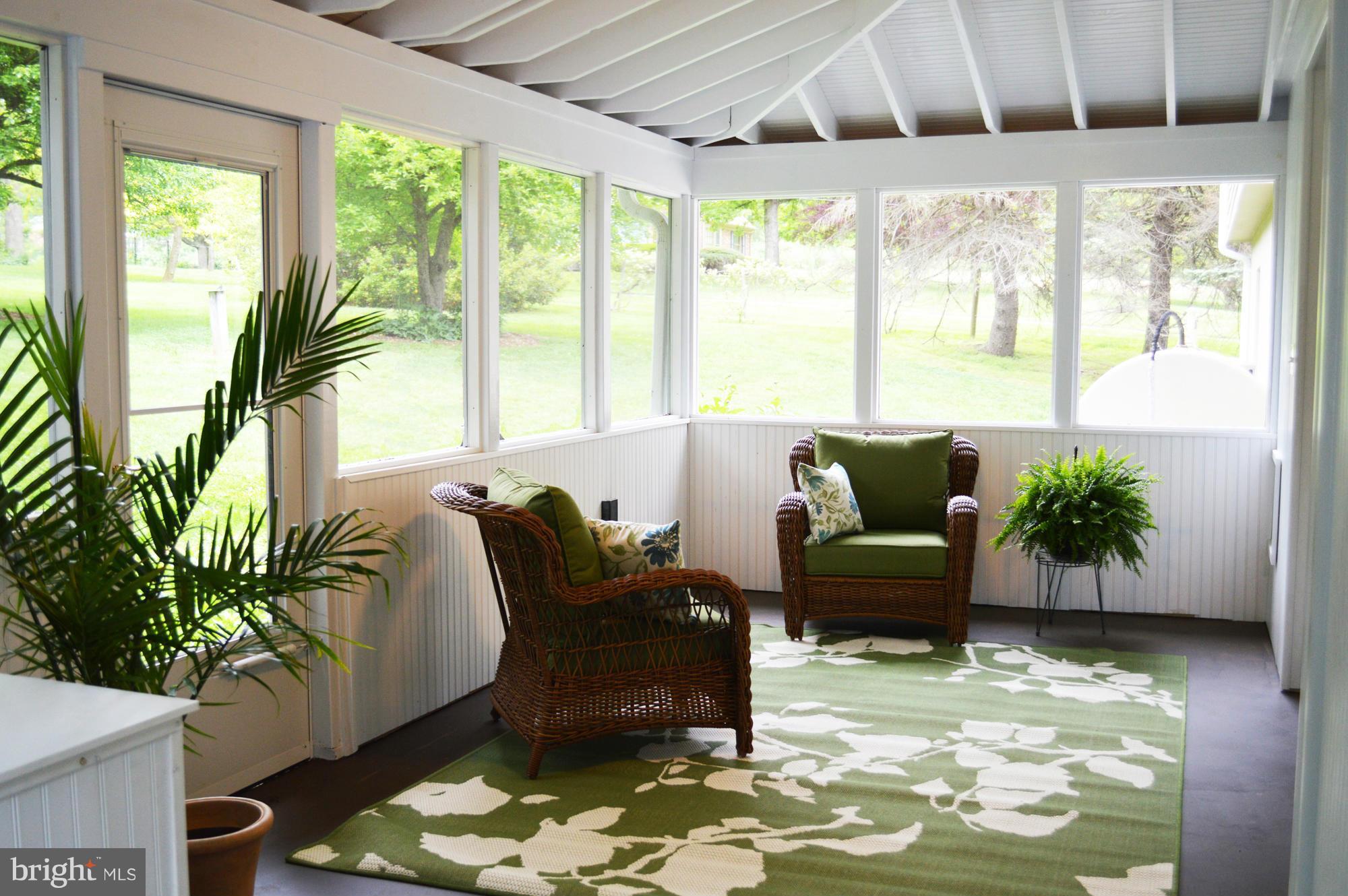 22524 Shiloh Church Road Boyds, MD 20841 - Photo 15 of 20 a living room with furniture potted plant and a large window