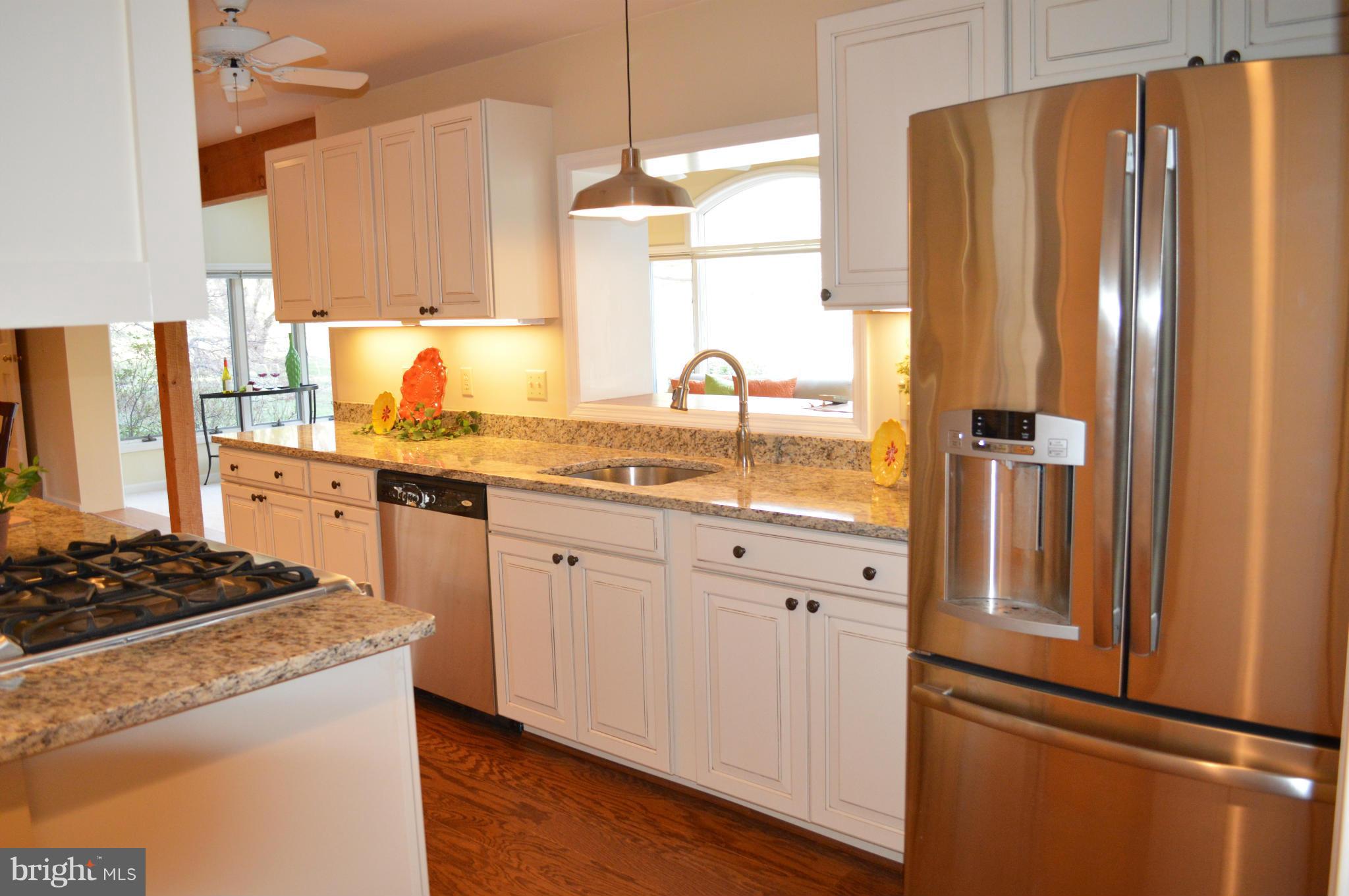 22524 Shiloh Church Road Boyds, MD 20841 - Photo 5 of 20 a kitchen with stainless steel appliances granite countertop a refrigerator and a sink