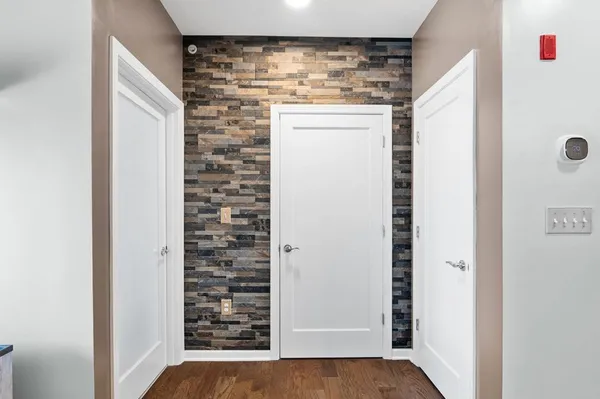 a view of a hallway with closet