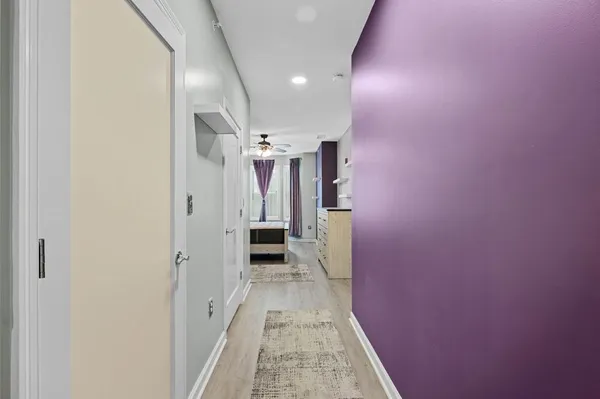 a view of a hallway with a white walls