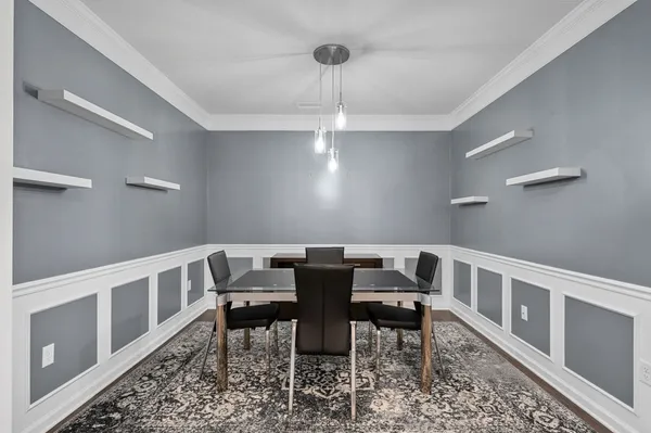 a view of a dining room with furniture window and wooden floor