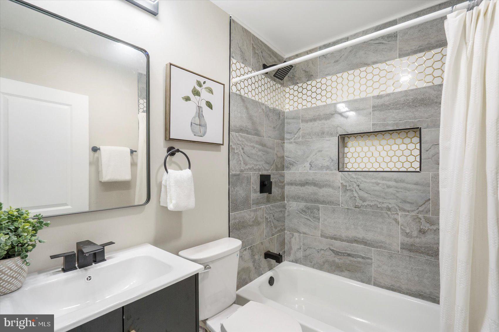 8121 Hillendale Road Parkville, MD 21234 - Photo 23 of 47 a bathroom with a sink a toilet and shower