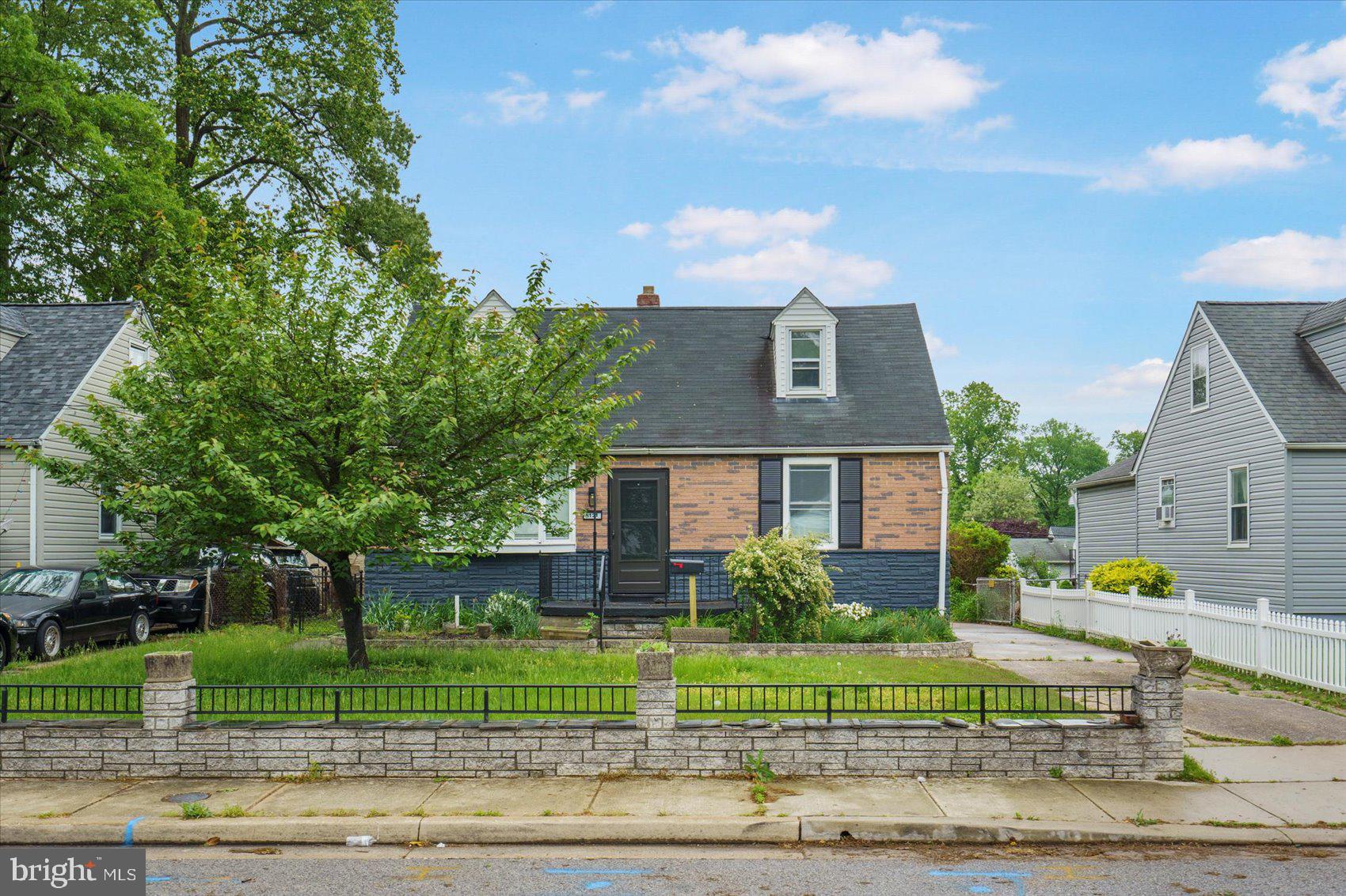 8121 Hillendale Road Parkville, MD 21234 - Photo 3 of 47 a front view of a house with a garden
