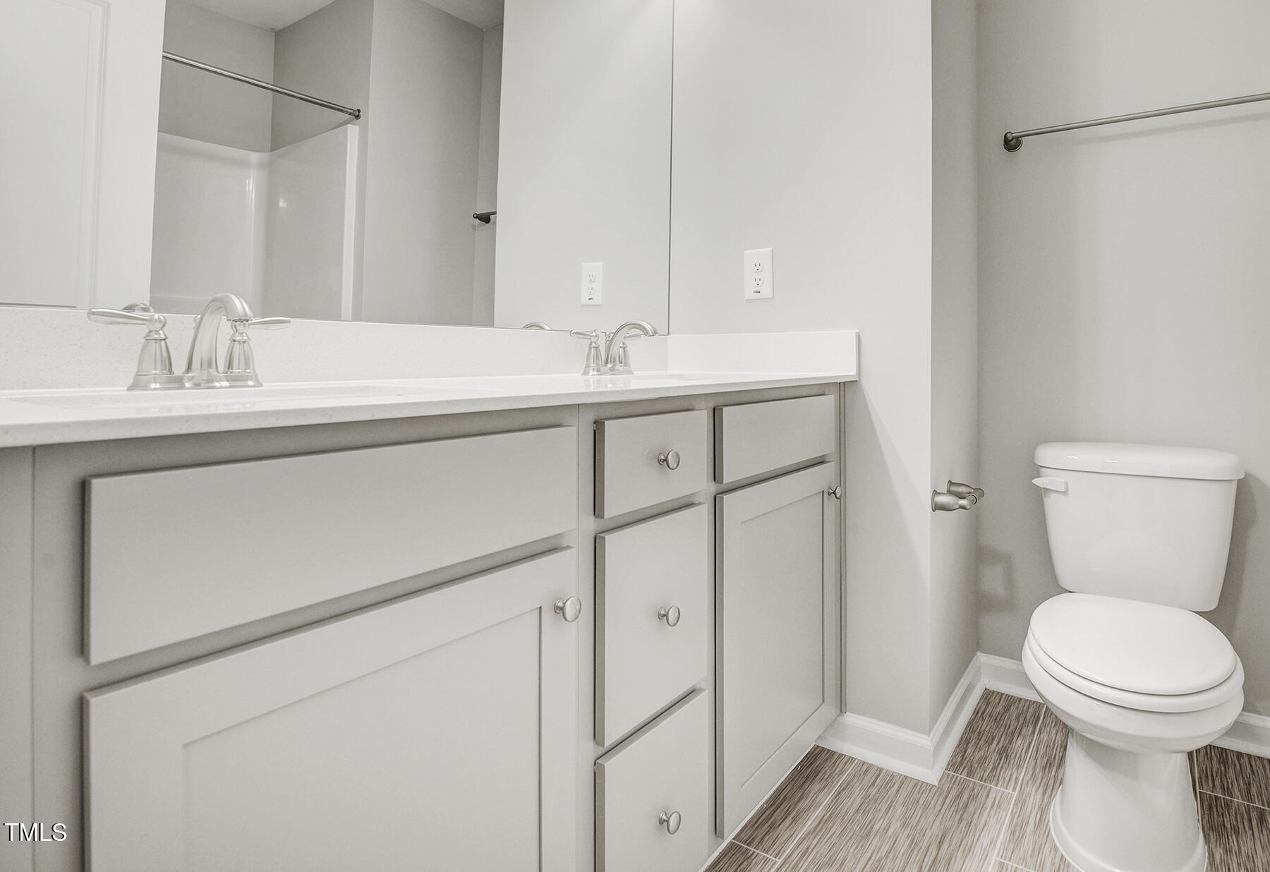67 Stewarts Knob Drive Clayton, NC 27527 - Photo 15 of 26 a bathroom with a toilet sink and mirror