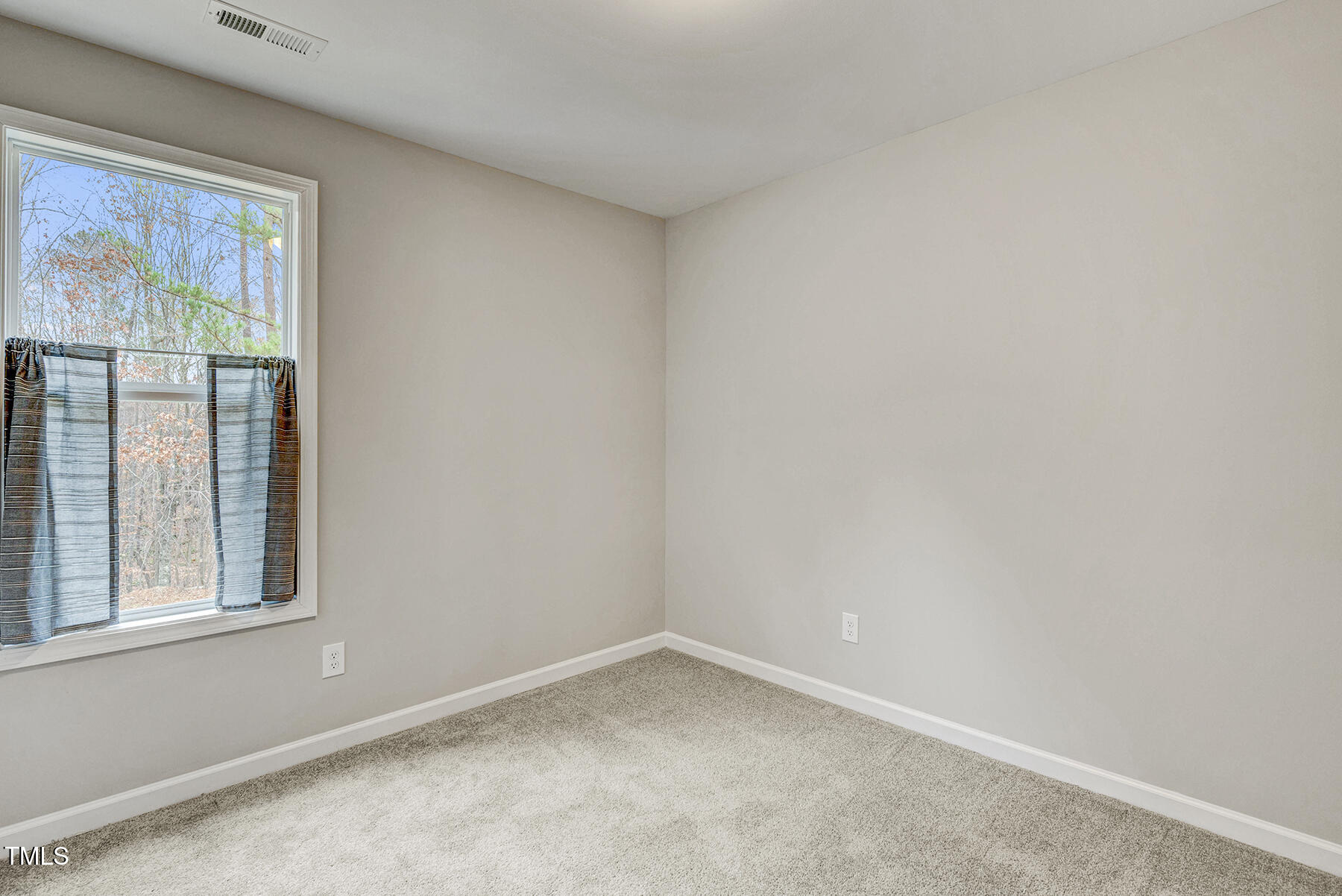 67 Stewarts Knob Drive Clayton, NC 27527 - Photo 19 of 26 an empty room with a window