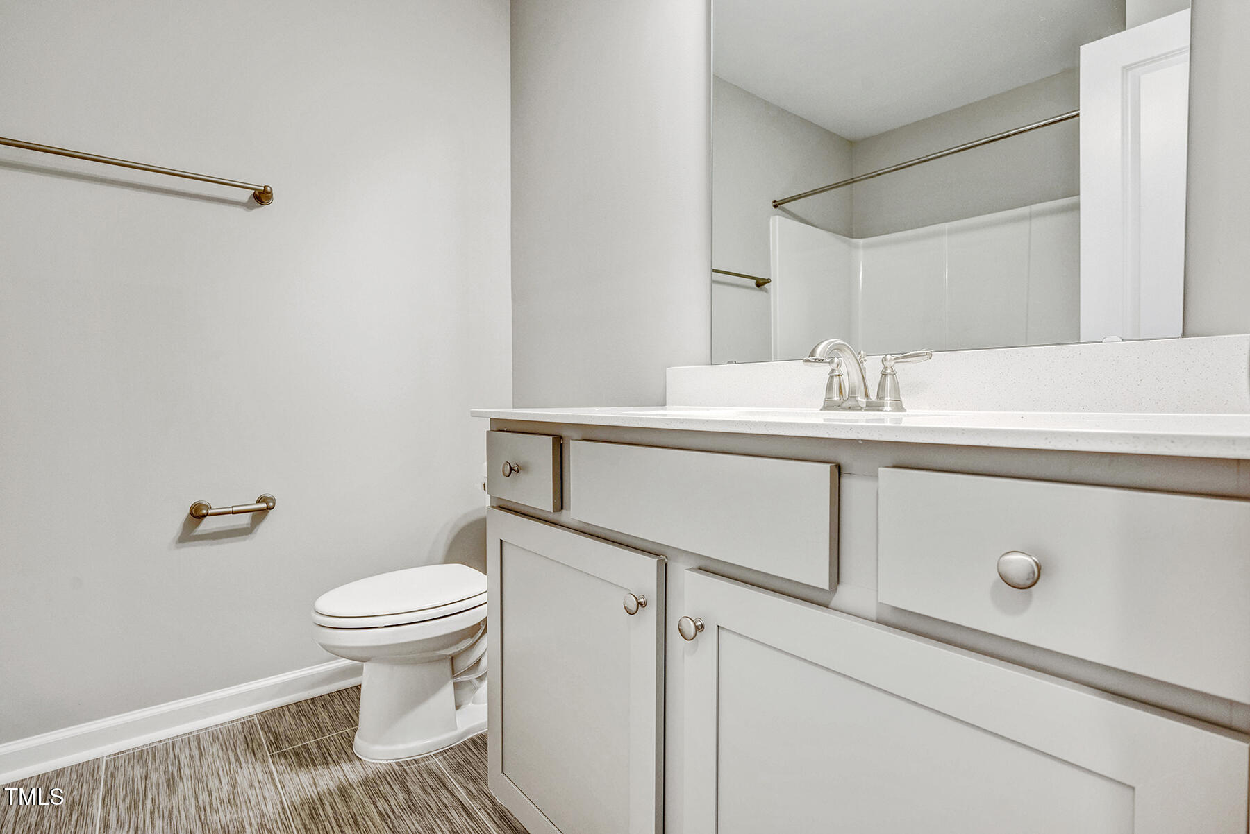 67 Stewarts Knob Drive Clayton, NC 27527 - Photo 22 of 26 a bathroom with a sink and a toilet