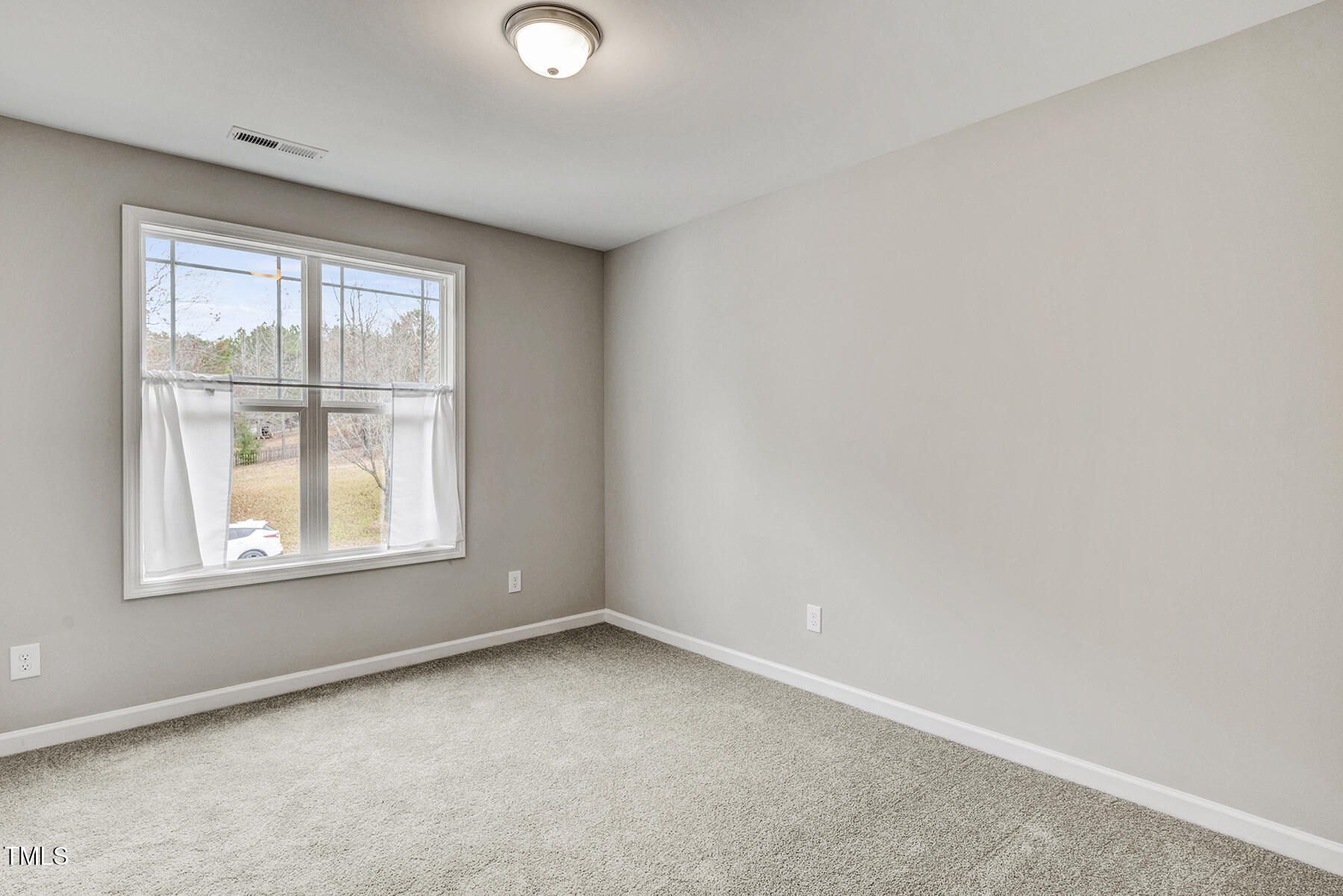 67 Stewarts Knob Drive Clayton, NC 27527 - Photo 23 of 26 an empty room with a window