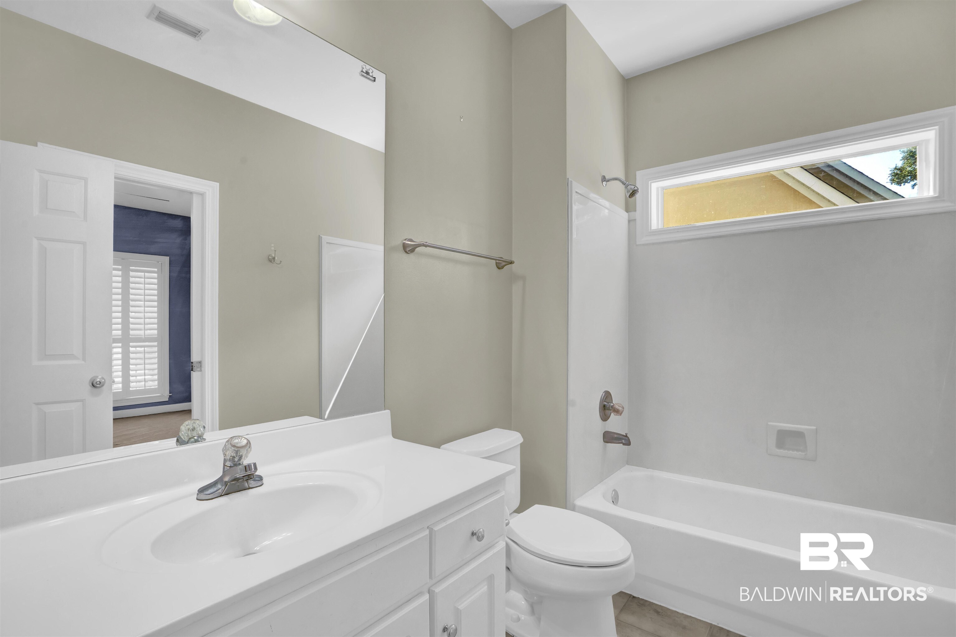 111 Beaver Dam Road Fairhope, AL 36532 - Photo 32 of 51 Full bathroom with shower / tub combination, plenty of natural light, and toilet