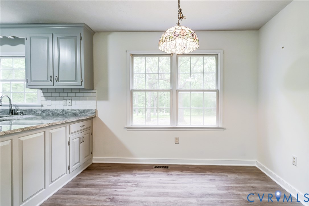 3820 Mt Pleasant Road Providence Forge, VA 23140 - Photo 7 of 40 a bathroom with a granite countertop sink and a window