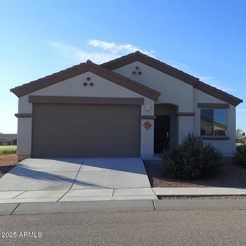 a front view of a house with garage