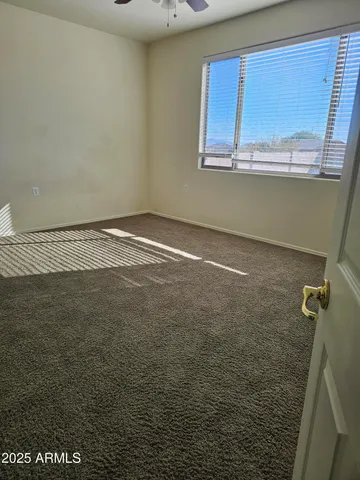 a bathroom with a glass door shower a sink and a mirror