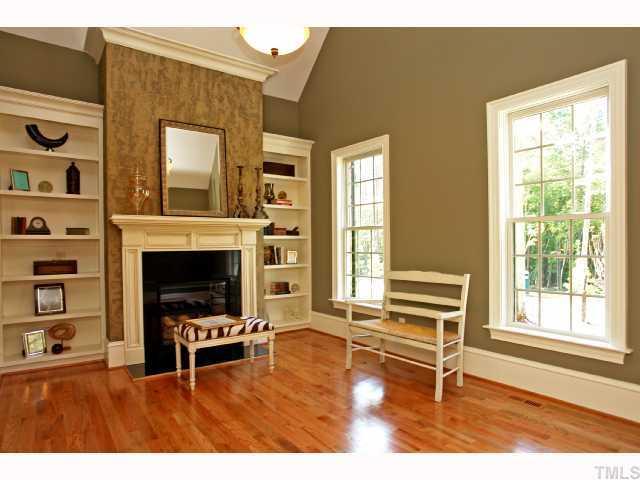 4843 Inwood Road Raleigh, NC 27603 - Photo 2 of 12 a living room with furniture and a fireplace