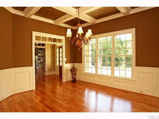 4843 Inwood Road Raleigh, NC 27603 - Photo 3 of 12 a view of empty room with wooden floor and fan