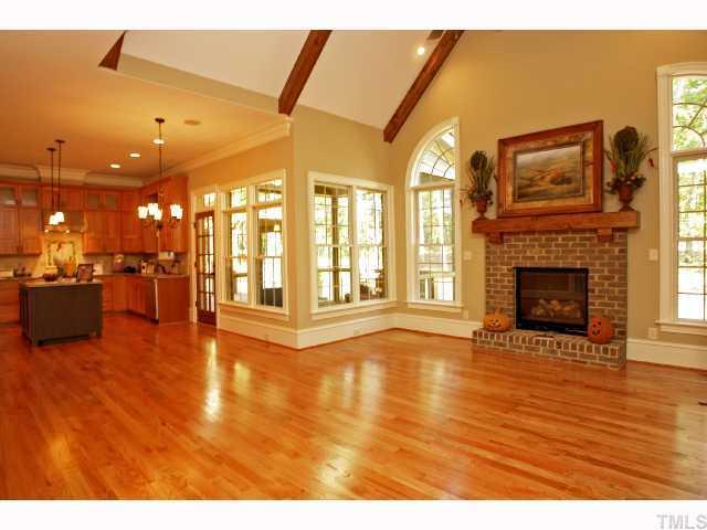 4843 Inwood Road Raleigh, NC 27603 - Photo 4 of 12 a view of an empty room with a fireplace