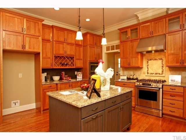 4843 Inwood Road Raleigh, NC 27603 - Photo 6 of 12 a kitchen with a sink and stove