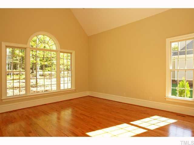 4843 Inwood Road Raleigh, NC 27603 - Photo 8 of 12 a view of an empty room with a window