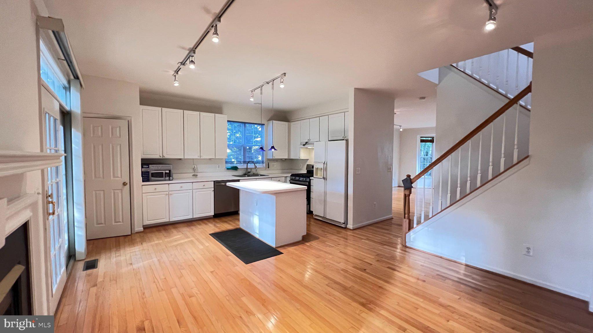 4100 Flower Fairfax, VA 22030 - Photo 12 of 47 a view of a kitchen with wooden floor and electronic appliances