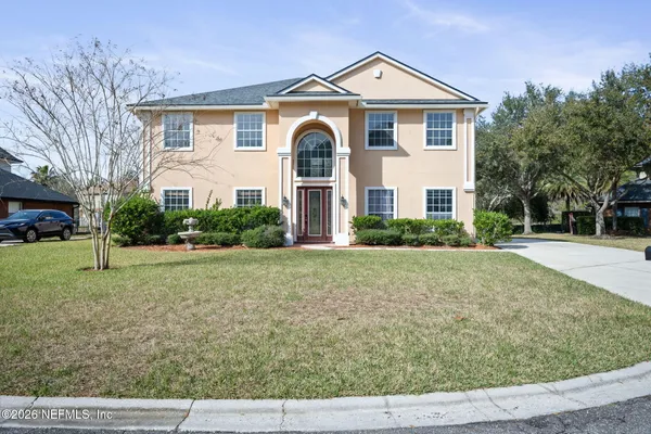 a front view of a house with a yard