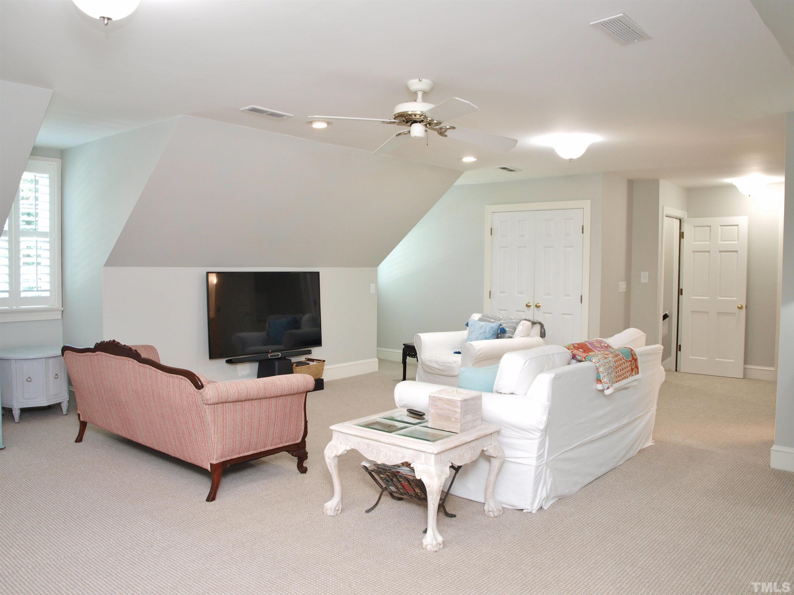 2905 Bolo Trail Raleigh, NC 27615 - Photo 16 of 25 a living room with furniture and a flat screen tv