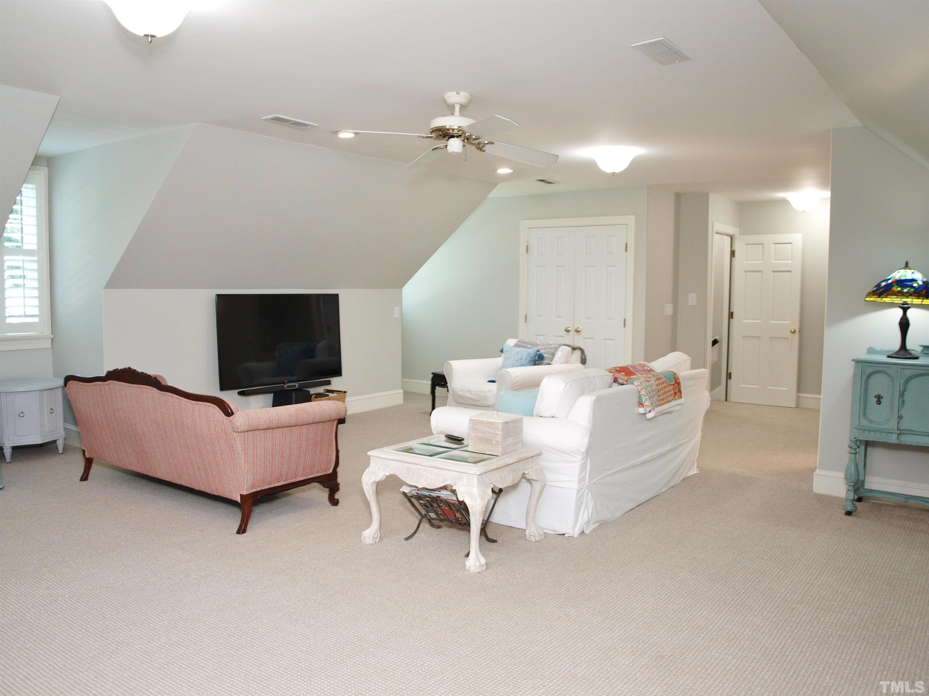 2905 Bolo Trail Raleigh, NC 27615 - Photo 19 of 25 a living room with furniture and a flat screen tv