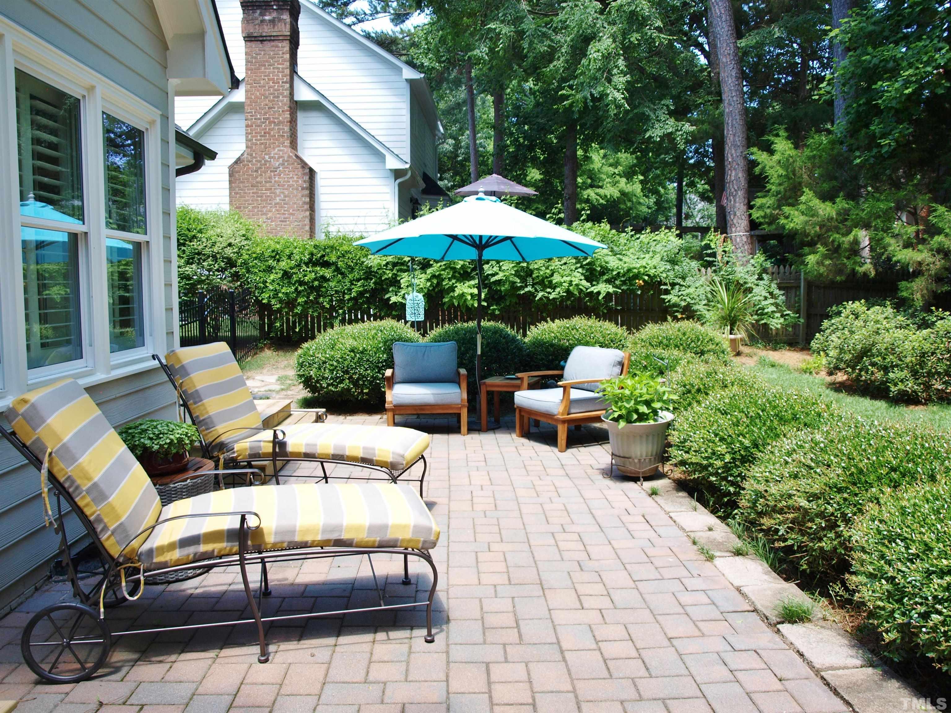 2905 Bolo Trail Raleigh, NC 27615 - Photo 21 of 25 a view of a patio with couches table and chairs and potted plants