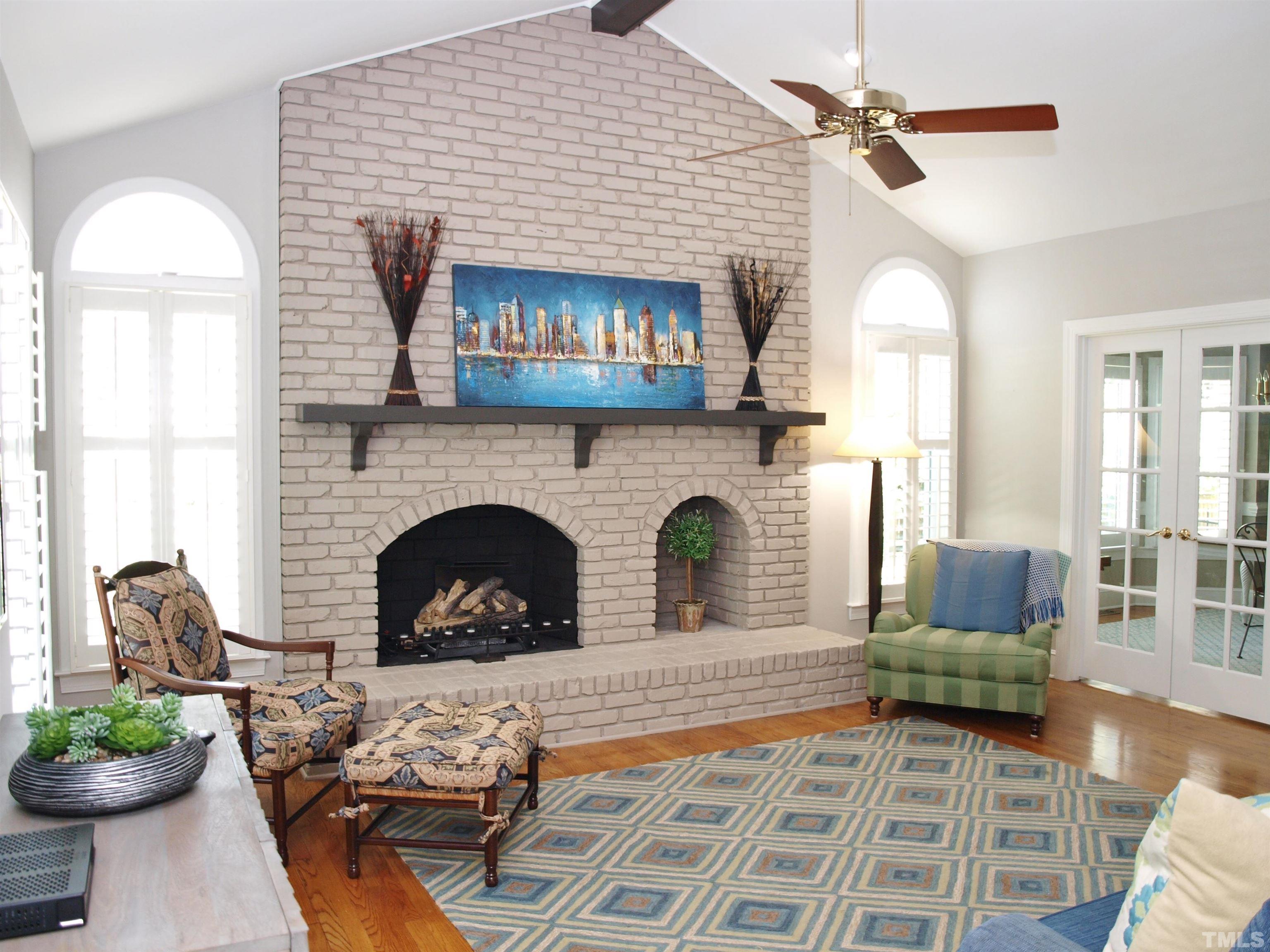 2905 Bolo Trail Raleigh, NC 27615 - Photo 4 of 25 a living room with furniture and a fireplace