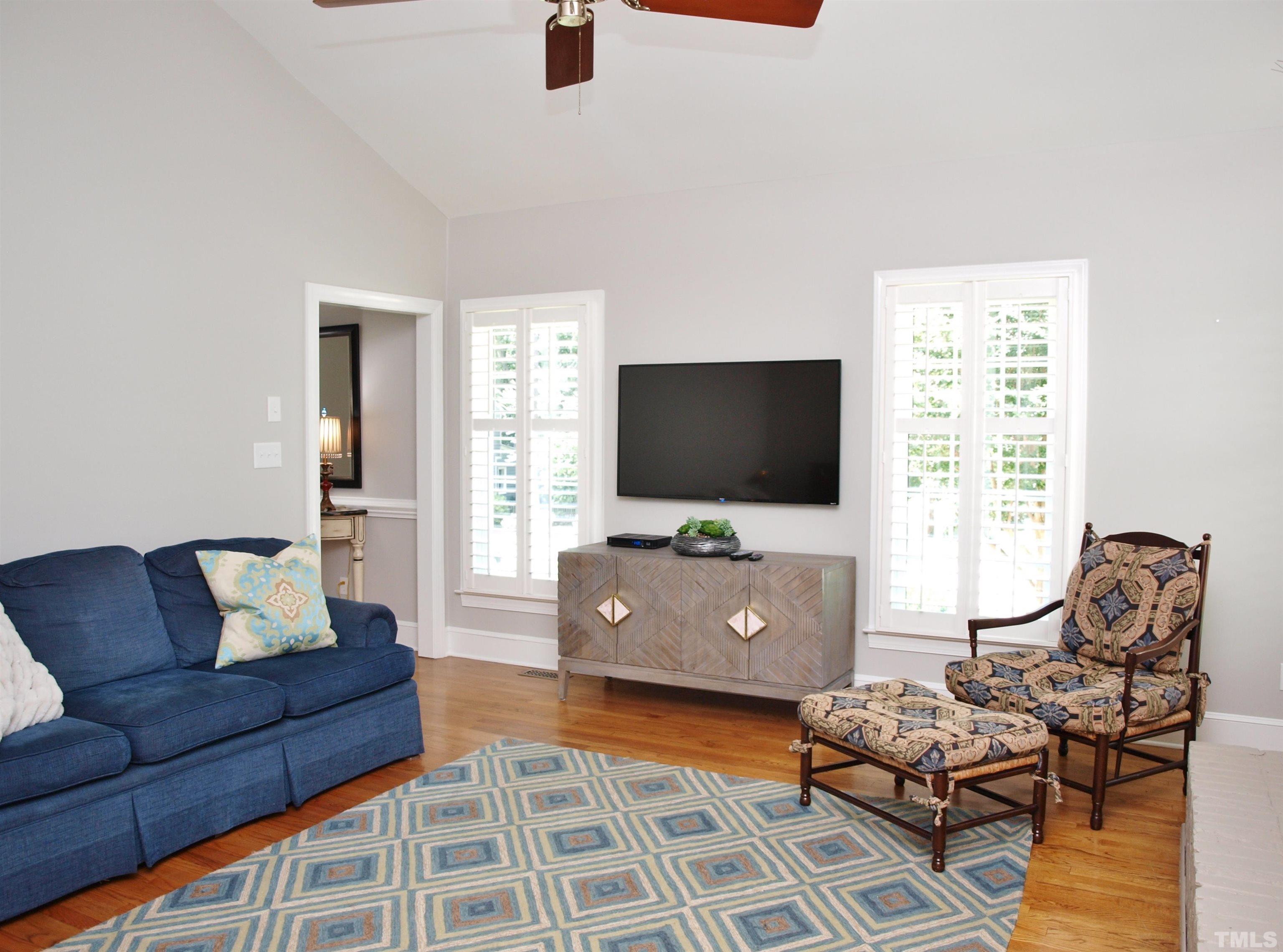 2905 Bolo Trail Raleigh, NC 27615 - Photo 5 of 25 a living room with furniture and a flat screen tv