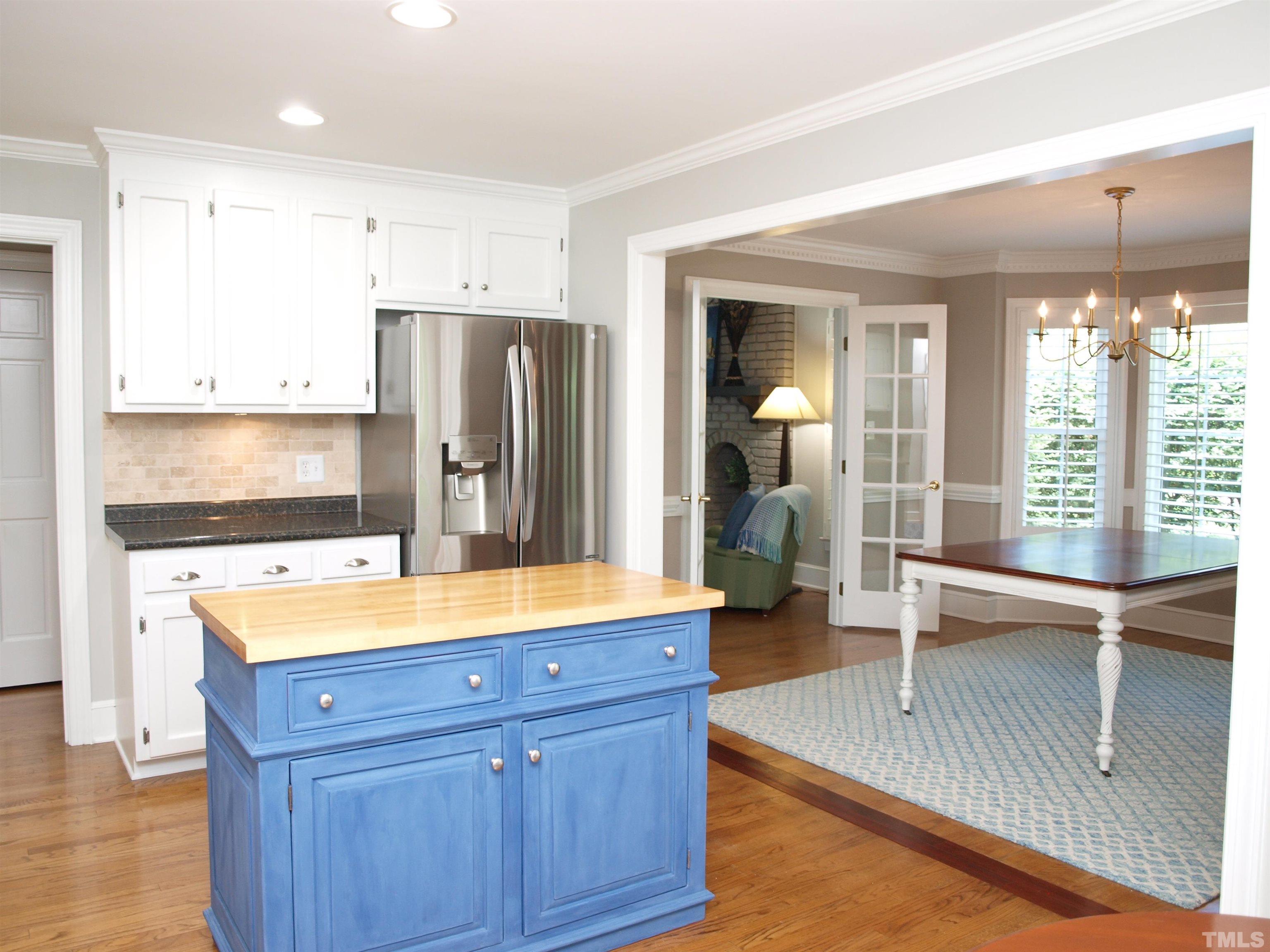 2905 Bolo Trail Raleigh, NC 27615 - Photo 8 of 25 a kitchen with a refrigerator and a sink